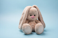 Soft Toy Rabbit. Easter Bunny On A Blue Background