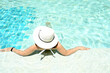© kathayut - Girl relaxing in pool summer Tropical beach lifestyle.