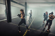 © qunica.com - Group of athletic young fit girls in sportswear boxing in gym.