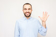 Bearded man shows fingers five, white background, copy space