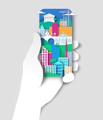 Hand holding mobile phone with city elements, urban landscape. Vector illustration in paper art style.