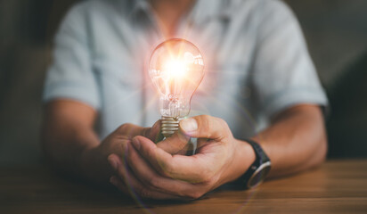 businessman holding light bulb, Creative new idea. Innovation, brainstorming, inspiration and solution concepts..