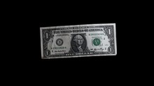 A One Dollar Banknote Fluttering On A Black Background. A Dollar Bill Flies In The Wind.