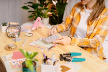 Cropped Shot Of Women Making Homemade Scrapbooking Album From Paper. DIY, Hobby Concept, Gift Idea, Decor With Handcraft Attributes, Home Production, The Process Of Creation, Creativity.