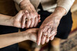 © pikselstock - Cropped shot of a senior woman holding hands with a nurse