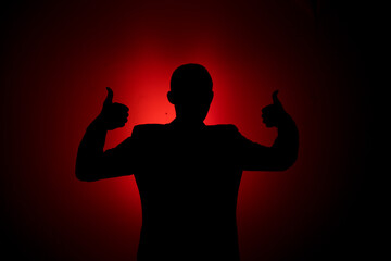 Wall Mural - Silhouette of a man on a red background.