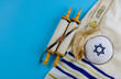 Jewish prayer book with torah scroll and shofar horn, prayer shawl tallit