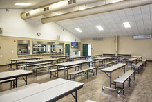 Empty School Cafeteria Due To COVID-19 Pandemic Shutdown. Empty Tables And Benches