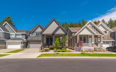 A perfect neighbourhood. Houses in suburb at Summer in the north America. Luxury houses with nice landscape.