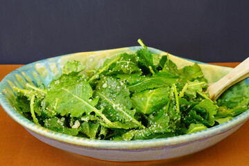 Wall Mural - Fresh young green kale salad in a bowl