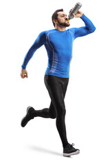 Wall Mural - Full length shot of a fit man running  and drinking from a bottle