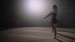 three sporty teen girls are training floor exercises of artistic or rhythmic gymnastics slow motion, junior sport competition