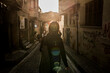 © Connect Images - Woman in alleyway in street, Karakoy, Turkey