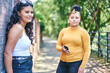 © Connect Images - Young woman with teenage sister by park