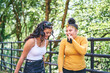 © Connect Images - Young woman chatting with teenage sister in park