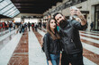 © Connect Images - Couple taking selfie with smartphone in station