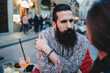 © Connect Images - Man gazing intensely into woman's eyes in cafe