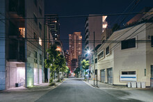 Night Scene Of Downtown Apartment Blocks, Retail Buildings And Modern Office Buildings In Distance, Osaka, Japan