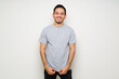 © AntonioDiaz - Good-looking hispanic man with a mock up gray t-shirt