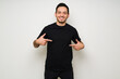 © AntonioDiaz - Hispanic man showing a design print on a black t-shirt