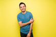 © AntonioDiaz - Cheerful man in his 30s standing against a colorful background