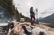 © Connect Images - Woman standing on a mountain in the Squamish Valley, British Columbia, Canada, playing the saxophone.