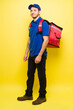 © AntonioDiaz - Portrait of a latin man working as a delivery courier