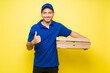 © AntonioDiaz - Hispanic young man making a fast food delivery