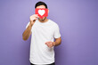 © AntonioDiaz - Cheerful hispanic man using the like button on social media