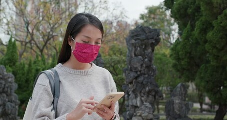 Canvas Print - Woman wear face mask and use of cellphone at pandemic period