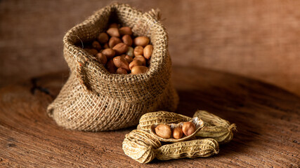 Peanuts dried fruits on nature background.