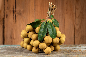 Longan fruits on an old wood background.