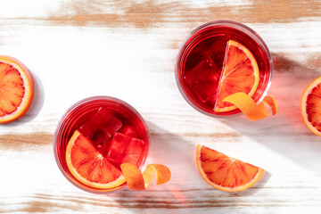 Wall Mural - Cocktails with blood orange juice, overhead shot with copy space