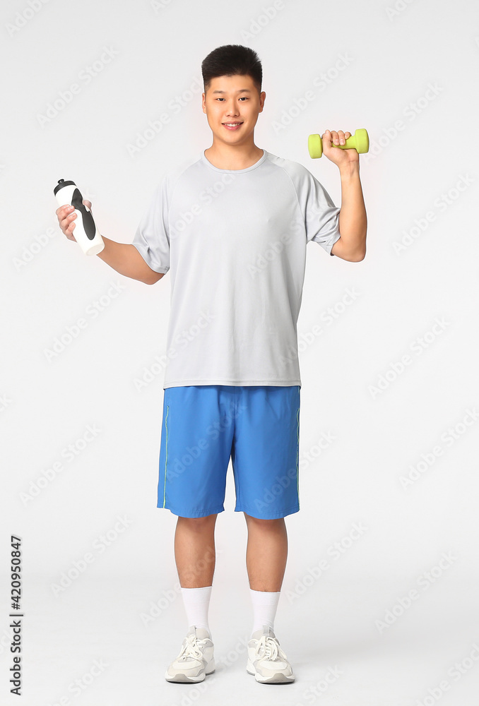 Sporty Asian man on white background
