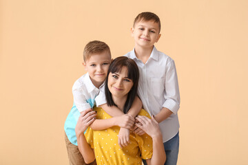 Poster - Happy mother and cute children on light background