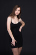© Roman Kornev - Young brown-haired woman, studio photo on black background