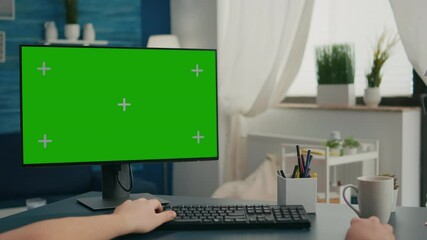 POV of caucasian man working on business conference using isolated pc. Male looking at computer with mock up green screen chroma key sitting on desk in living room