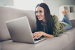 © deagreez - Full body photo of young attractive woman happy positive smile look read browse laptop work distance home