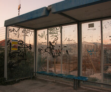 Graffiti Blown Glass Bus Stop. Industrial District In Croatia