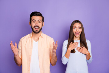 Portrait of two astonished persons open mouth look camera cant believe isolated on purple color background