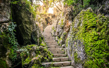 Stairs Pathway In Middle Of Limestone Rock Formation And Dramatic Light At Shilin Stone Forest Park Yunnan China