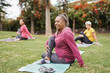 © Sabrina - Multiracial women doing yoga exercise with social distance for coronavirus outbreak at park outdoor - Healthy lifestyle and sport concept