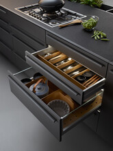 Modern kitchen, Open drawers, Set of cutlery trays in kitchen drawer. Solid oak wood cutlery drawer inserts.