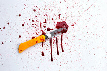 Stationery Knife With Blood On White