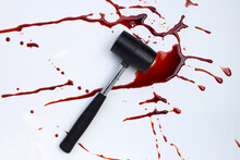 Hammer With Blood On White