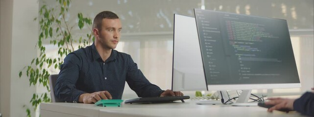 Programmers working in a software company office and typing a code. Software Engineering concept.