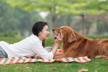 Sticker - Golden Retriever accompanies a woman to rest in the grass