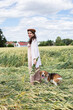 © PIXbank - White young woman in unripe wheat field