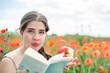 © PIXbank - White young woman in poppy field