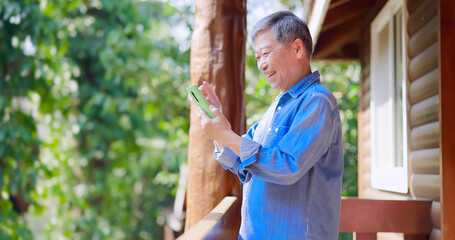 Poster - asian retired man use smartphone